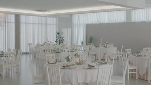 Elegant Wedding Reception Venue with Tables and Chairs