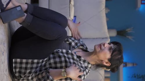 Woman Sitting on Floor Looks Distressed