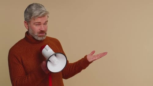 Man Talking with Megaphone Proclaiming News Loudly Announcing Advertisement Pointing Empty Place