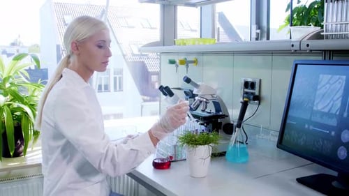 Woman Conducting Scientific Research in Modern Laboratory