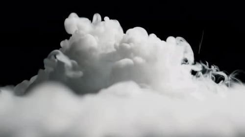 Wispy White Smoke Floating on a Black Background