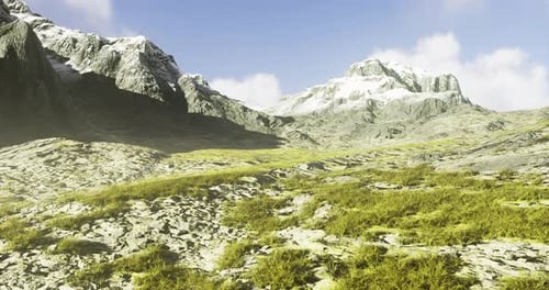 Majestic Mountain Landscape Under a Bright Blue Sky with Grassy Terrain