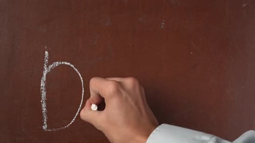 Writing 'Do it' on a Brown Surface