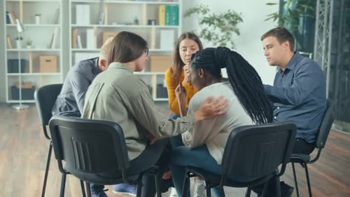 Supportive Friends Gathering in Bright Office Space