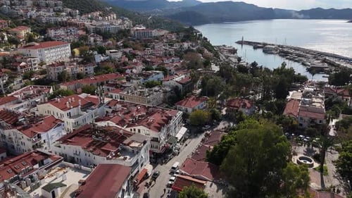 Aerial View of a Coastal Town with a Lively Marina and Hills Kas Turkey