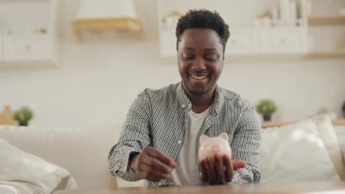 African American Person Saving Money for Dream Portrait of Man with Piggy Bank Economy and Financial