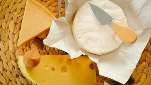 Assorted Cheese with Cutting Tools on Display
