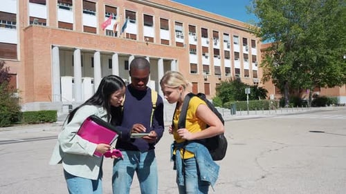 University students using smartphone in slow motion