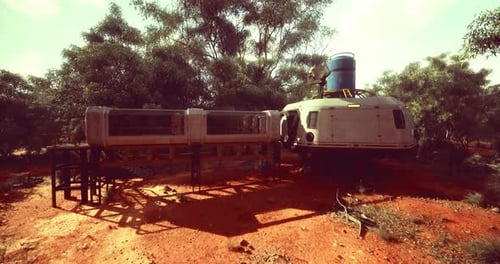 Rustic Settlement with Futuristic Structure in a Dense Forest During Daylight