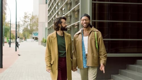 Cool Gay Couple Holding Hands While Walking in the City