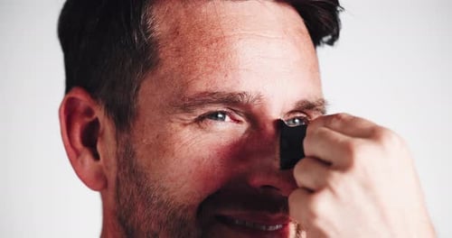 Peeling, man and nose strip for skincare, blackhead removal or results closeup on white studio