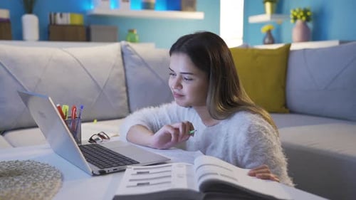 Young Woman Studying from Home with Laptop