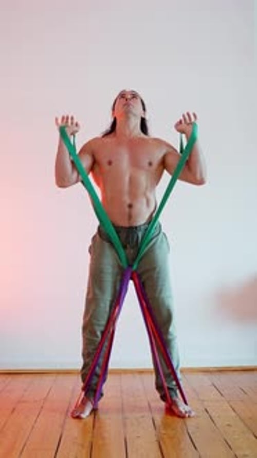 An Athlete Actively Engaging with Resistance Bands to Enhance Strength Training Regimen