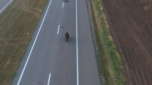 Aerial Shot of Motorcyclist Racing His Motorcycle on Country Road Man Riding on Modern Sport