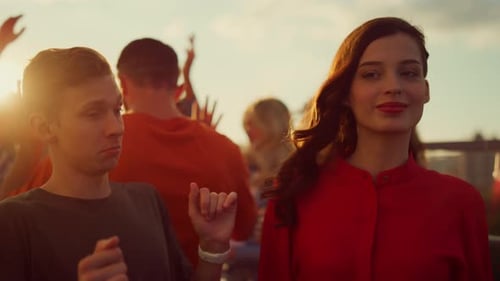 Friends Celebrate at Rooftop Party During Golden Hour