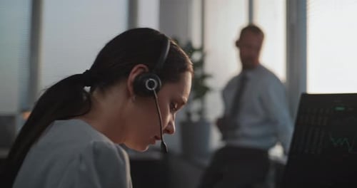 Serious Female Stock Trader Works on Computer Communicates with Business Client