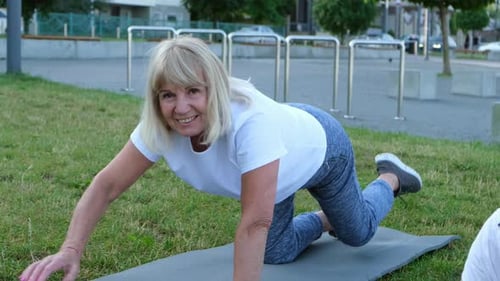 Senior Elderly Woman Doing Fitness in the Summer Park in the Morning Pensioners Healthy Lifestyle