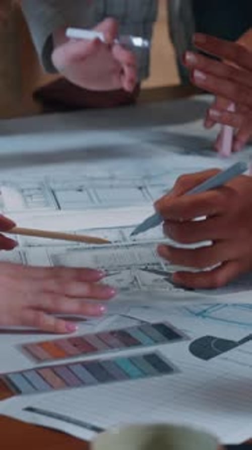 Creative Casual Informal Business Team Group Talking Discuss Building Papers Blueprint Plan Writing