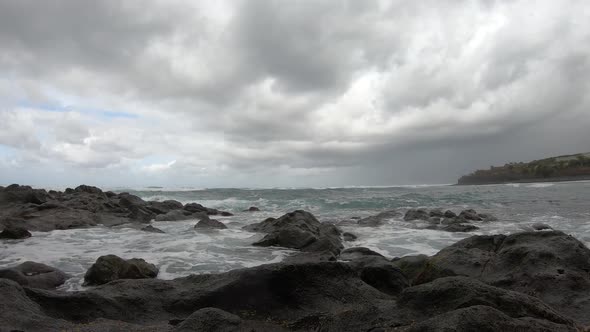 Timelapse of lava rock beach with heavy clouds in Tenerife, Canary ...