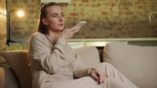 Woman Using Voice Command on Mobile Phone