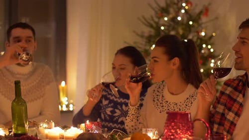 Friends Drink Wine at Festive Dinner Party
