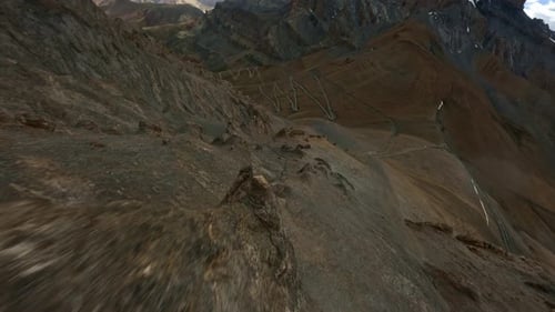 FPV Drone Descending a Mountain Slope in Tibet