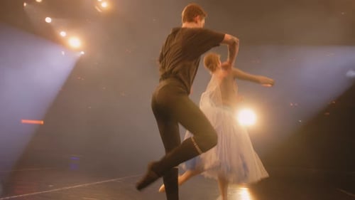 Ballet Dancers Perform Dramatic Duet on Stage