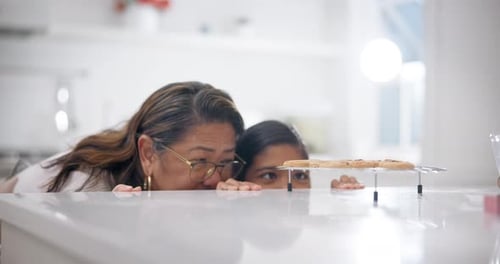 Woman Steals Cookie with Watching Girl