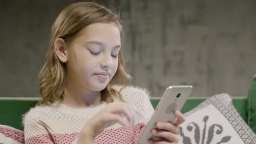 Girl Using Smartphone Indoors