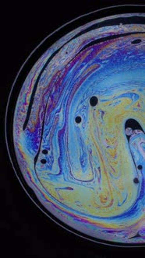 Abstract Sphere of Iridescent Liquid Motion on Black