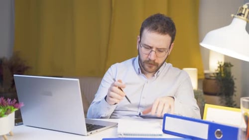 Home office worker man doing research.
