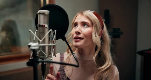 Music, microphone and woman with singing in studio for entertainment, production and broadcast