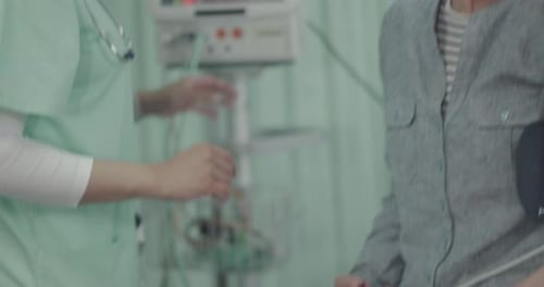 Female Doctor Examining Senior Patient in Hospital