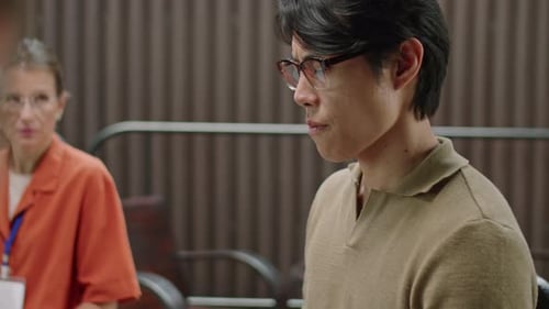 Young Adult Talking Assertively at a Business Meeting