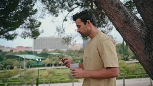 Relaxed Tourist Walking Park Holding Beverage Takeaway Close Up Guy Strolling