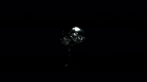 Submerge Collection: Big bubbles bursting out very slowly from the bottom on a black background