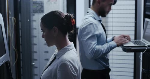 Technicians Working in Data Center Server Room