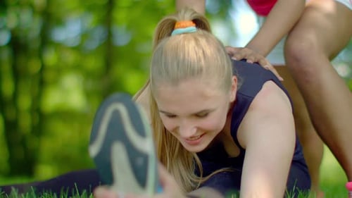 Woman Stretching Outdoor. Stretching Exercise In Park. Female Athlete Warm Up Before Run. Closeup...
