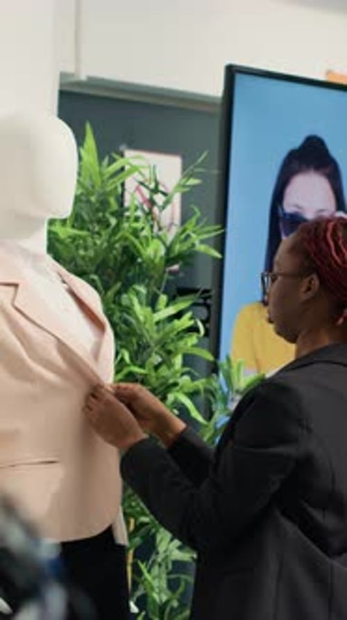 Adult Adjusting Jacket on Mannequin Indoors
