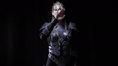 Alien woman with scary face and eyes is using an alien technology, 4k