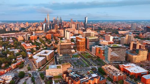Sunlit scenery of Philadelphia downtown at sunset. Skyscrapers complex in the centre of the footage