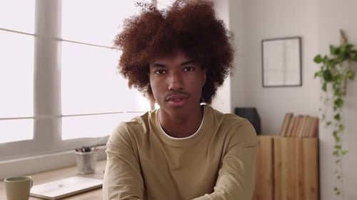 POV or Front Portrait of Happy Millennial Latin American Guy Smiling at Camera