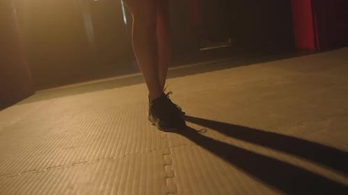 Legs of Unrecognizable Sportswoman Jumping Rope