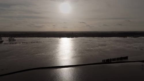 Flooded riverbanks at river Waal in the Netherlands, backlight