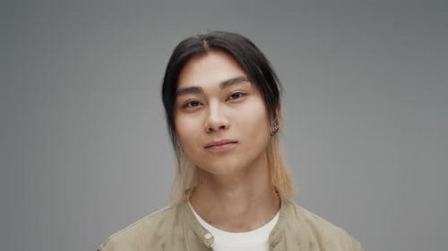 Young Adult Smiling with Stylish Hairstyle