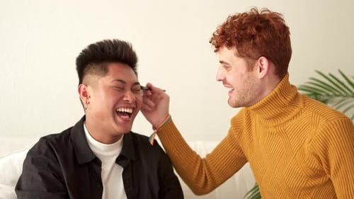 Two Friends Having Fun Indoors with Make-up