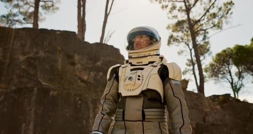 World, travel and astronaut walking in forest to explore abandoned area, planet and universe