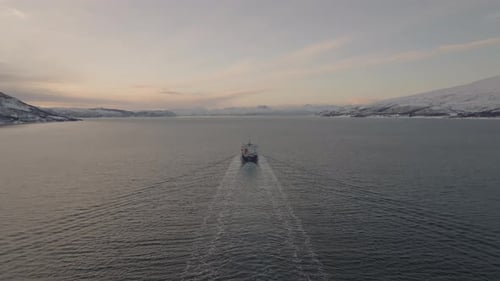 Aerial view of freight cargo ship in Norwegian Sea. Trade and transport concept