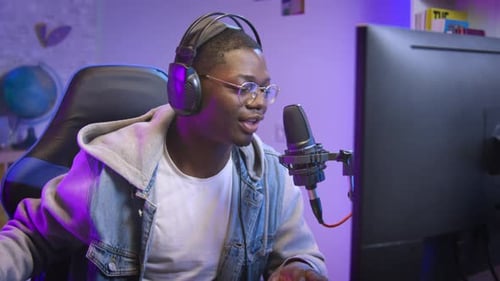 Young Adult Talking into Microphone While Gaming
