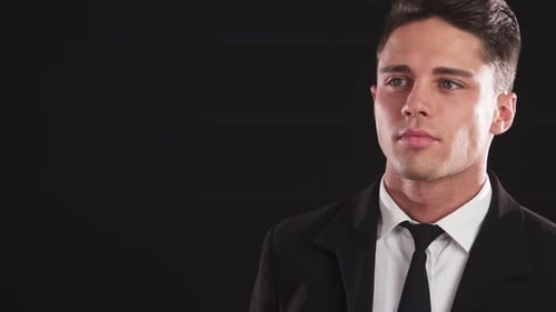 Man in Suit Gestures for Silence